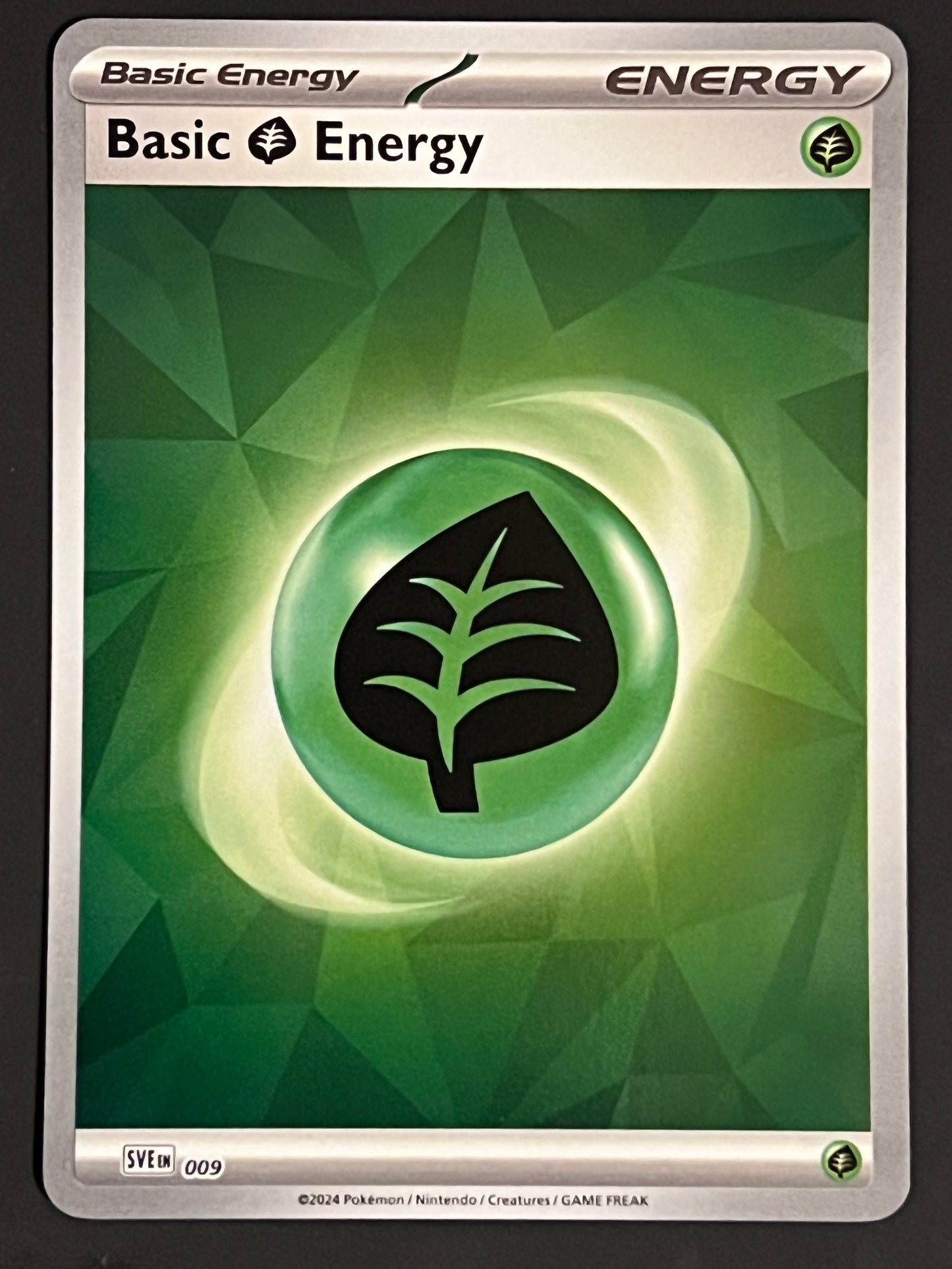 Energy 009 Grass - Pokémon Prismatic Evolutions Reverse