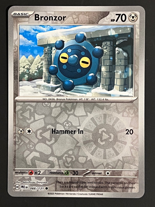 066/131 Bronzor - Pokémon Prismatic Evolutions Common Reverse