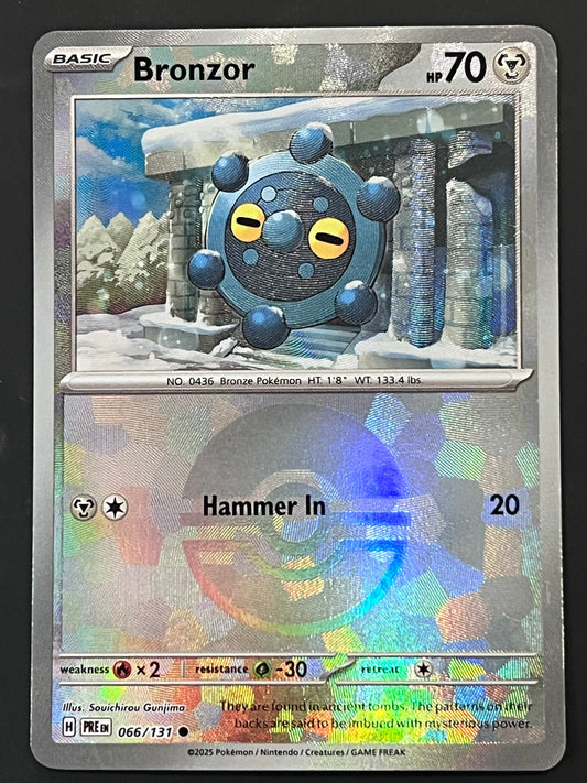 066/131 Bronzor - Pokémon Prismatic Evolutions Common Reverse POKEBALL